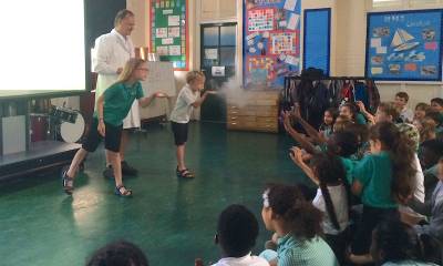 Prof Greg Towers demonstrates virus spread through sneezing at a visit to Gayhurst School in 2017