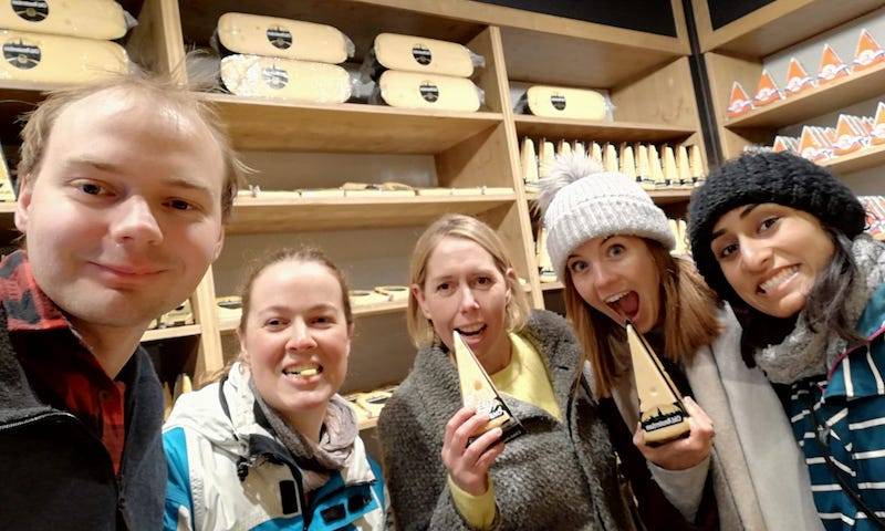 Morten, Maitreyi, Clare, Lucy and AK feasting on cheese in the Cheese Museum in the treasure hunt