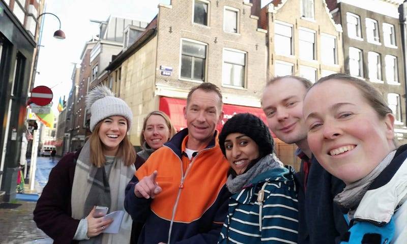 Morten, Maitreyi, Clare, Lucy and AK locate one of Amsterdam's friendly postmen in the treasure hunt