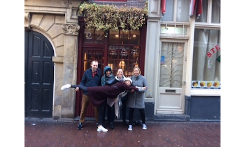 Morten, Maitreyi, Clare, Lucy and AK find the smallest house in Amsterdam, now a teashop in the treasure hunt