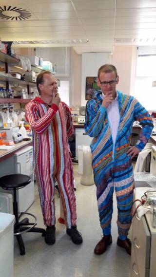 Prof Greg Towers and Dr Richard Milne test the onesies for the film 'A Virus Walks into a Bar'