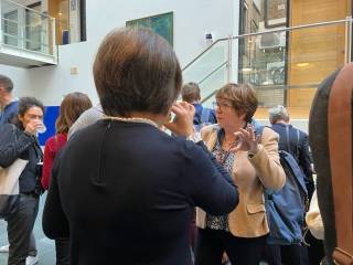 A photo showing guests mingling at UCL X AstraZeneca Open Innovation Collaboration Roadshow