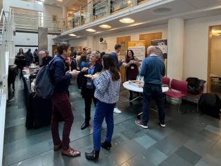 A photo showing guests mingling at UCL X AstraZeneca Open Innovation Collaboration Roadshow