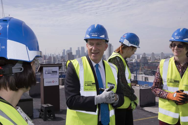 Photo of President and Provost Dr Michael Spence at the top of Pool Street West for the topping out ceremony of UCL East