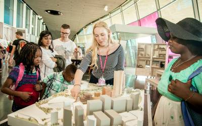 Participants at a UCL East public consultation event, looking over the model of the UCL East campus, in 2015-16