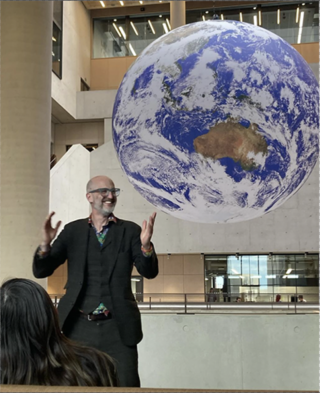 mark in front of the gaia globe