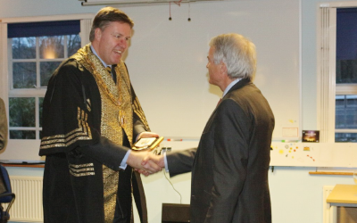 Master of the Clockmakers, Mark Elliott, presented the Clockmakers' Shield of Arms to the President and Provost of UCL