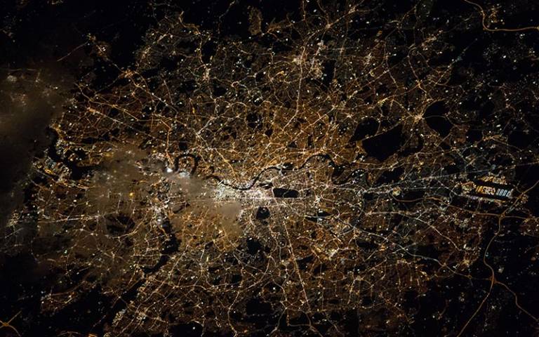 London at night from above (Credit: NASA/Tim Kopra) used under Attribution-NonCommercial 2.0 Generic (CC BY-NC 2.0) from Wikimedia Commons. 